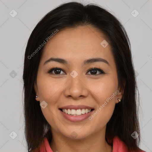 Joyful latino young-adult female with long  brown hair and brown eyes