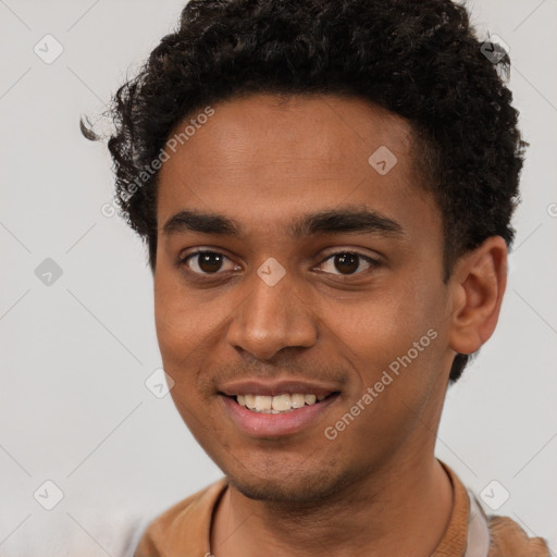 Joyful black young-adult male with short  brown hair and brown eyes