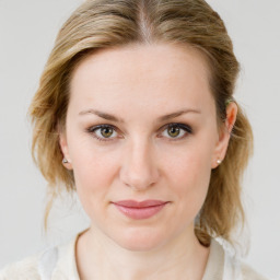 Joyful white young-adult female with medium  brown hair and blue eyes