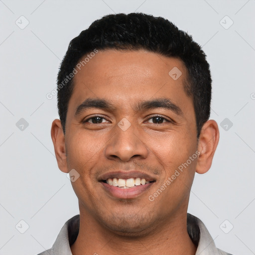 Joyful latino young-adult male with short  black hair and brown eyes