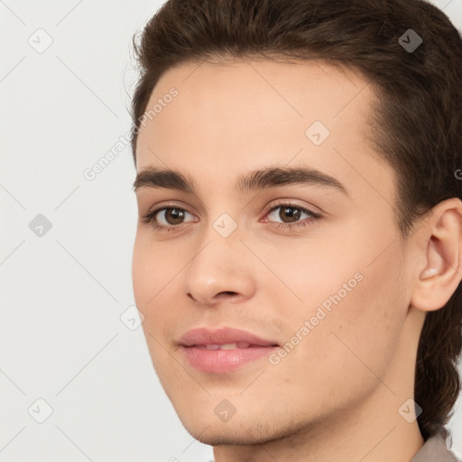 Joyful white young-adult male with medium  brown hair and brown eyes