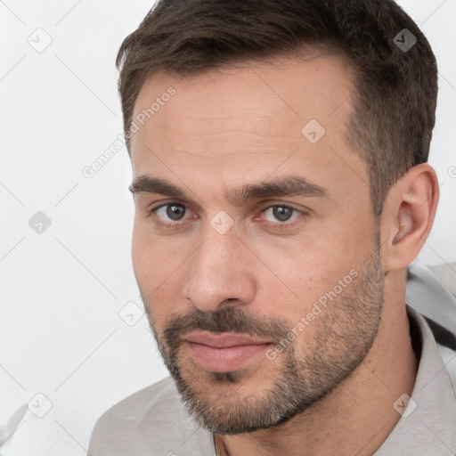 Neutral white young-adult male with short  brown hair and brown eyes