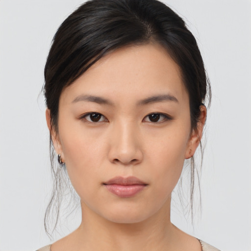 Neutral asian young-adult female with medium  brown hair and brown eyes