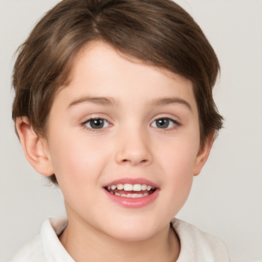 Joyful white child female with short  brown hair and brown eyes