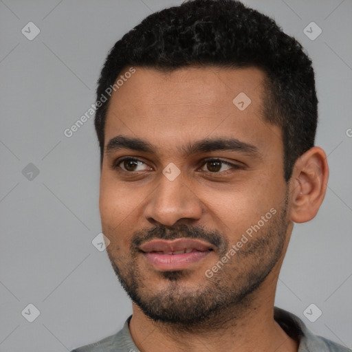 Joyful black young-adult male with short  black hair and brown eyes