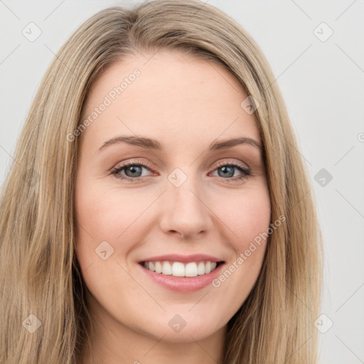 Joyful white young-adult female with long  brown hair and green eyes