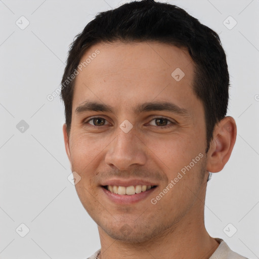 Joyful white young-adult male with short  brown hair and brown eyes