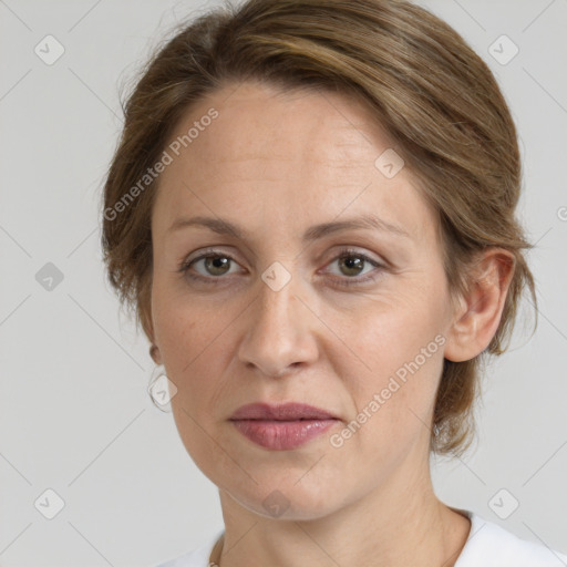 Joyful white adult female with medium  brown hair and grey eyes