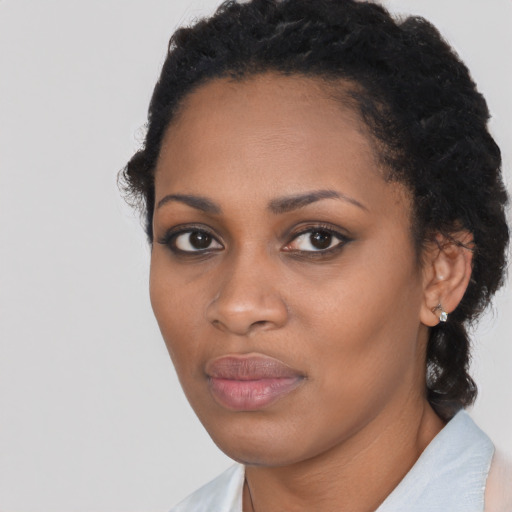 Neutral black young-adult female with medium  black hair and brown eyes