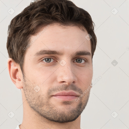 Neutral white young-adult male with short  brown hair and brown eyes