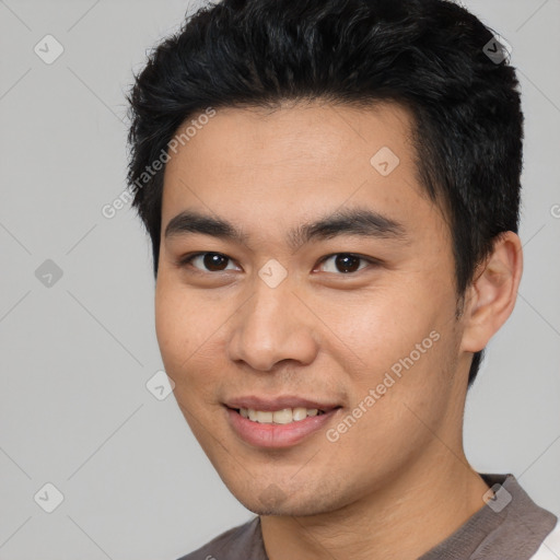 Joyful white young-adult male with short  black hair and brown eyes