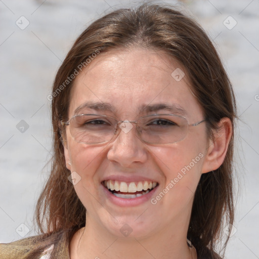 Joyful white adult female with medium  brown hair and grey eyes