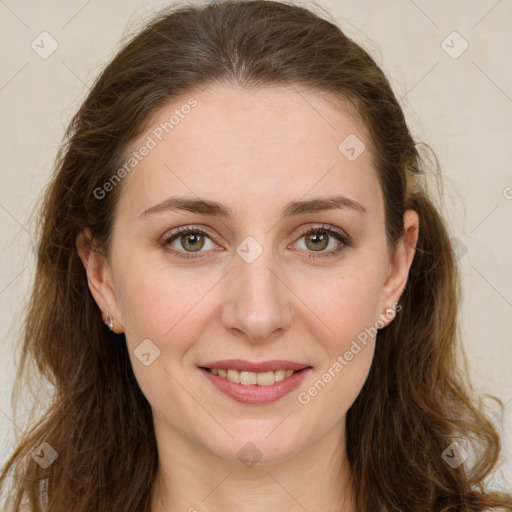 Joyful white young-adult female with long  brown hair and green eyes