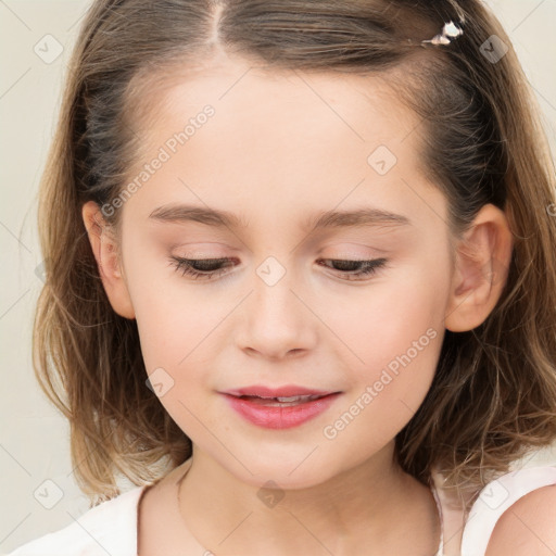 Joyful white child female with long  brown hair and brown eyes