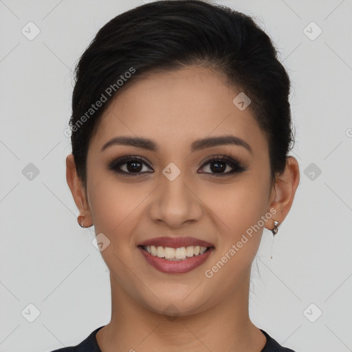 Joyful latino young-adult female with short  brown hair and brown eyes