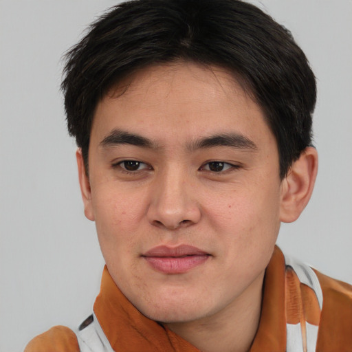 Joyful asian young-adult male with short  brown hair and brown eyes