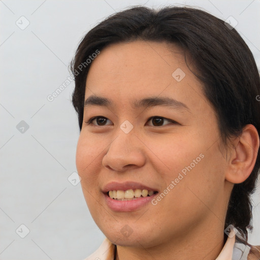 Joyful asian young-adult female with short  brown hair and brown eyes