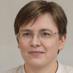 Joyful white adult female with short  brown hair and brown eyes