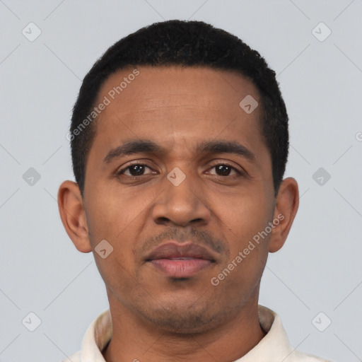 Neutral latino young-adult male with short  black hair and brown eyes