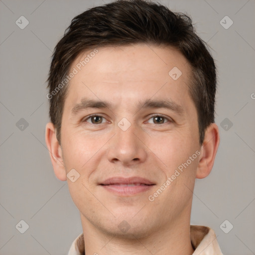 Joyful white young-adult male with short  brown hair and brown eyes