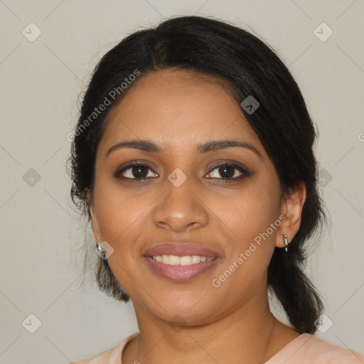 Joyful black young-adult female with medium  black hair and brown eyes