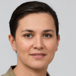 Joyful white young-adult female with short  brown hair and grey eyes