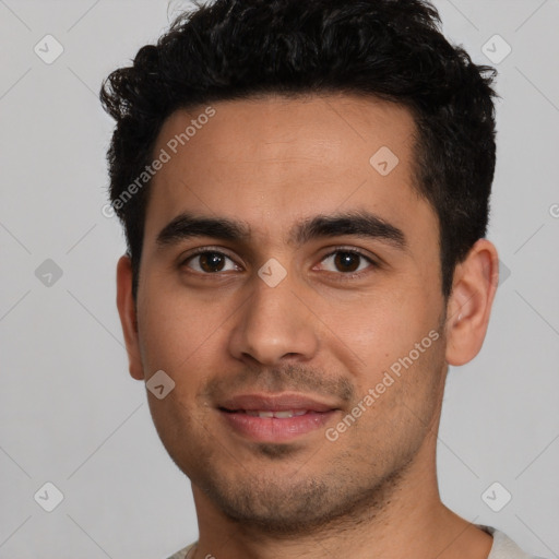 Joyful white young-adult male with short  black hair and brown eyes