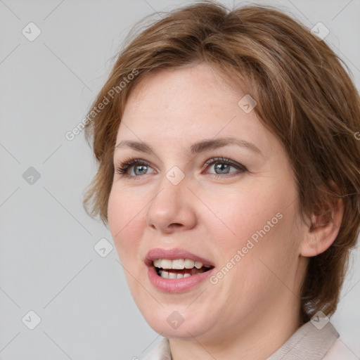 Joyful white young-adult female with medium  brown hair and blue eyes