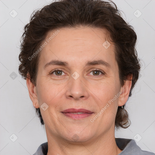 Joyful white adult female with short  brown hair and brown eyes