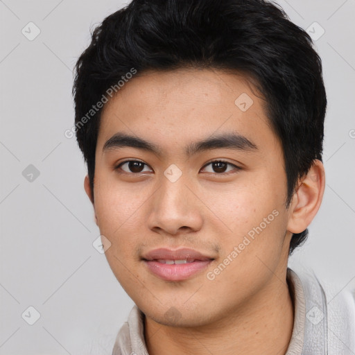 Joyful asian young-adult male with short  black hair and brown eyes