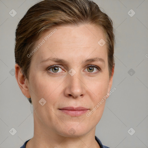 Joyful white adult female with short  brown hair and grey eyes