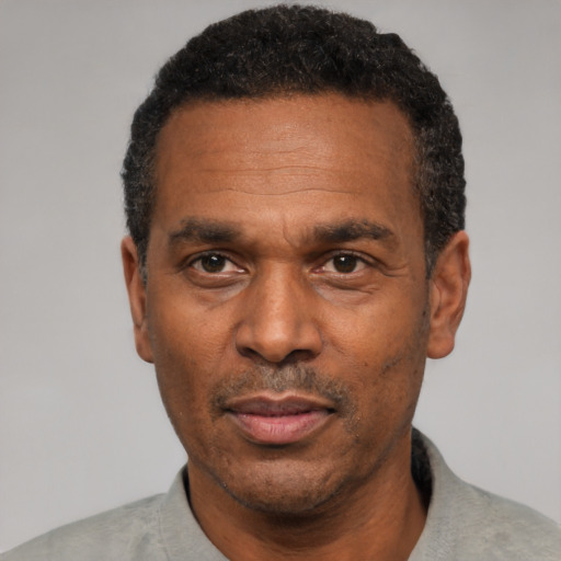 Neutral black adult male with short  black hair and brown eyes
