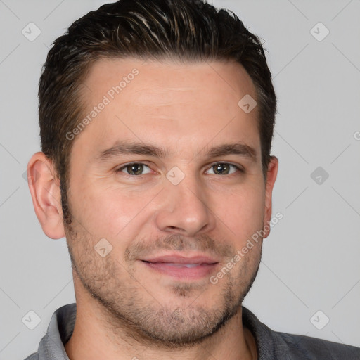 Joyful white adult male with short  brown hair and brown eyes