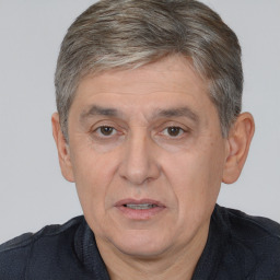 Joyful white middle-aged male with short  brown hair and brown eyes