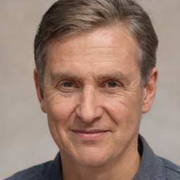 Joyful white middle-aged male with short  brown hair and brown eyes