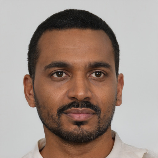 Neutral black young-adult male with short  black hair and brown eyes