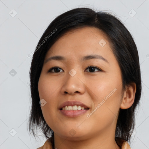 Joyful asian young-adult female with medium  black hair and brown eyes