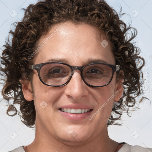 Joyful white adult female with medium  brown hair and blue eyes