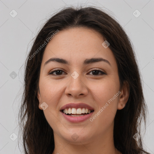 Joyful white young-adult female with long  brown hair and brown eyes