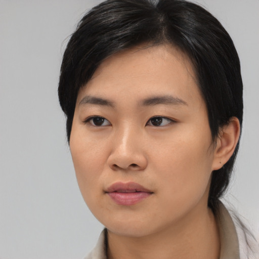 Neutral asian young-adult female with medium  black hair and brown eyes