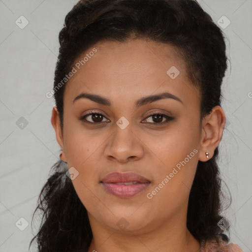 Joyful black young-adult female with long  brown hair and brown eyes