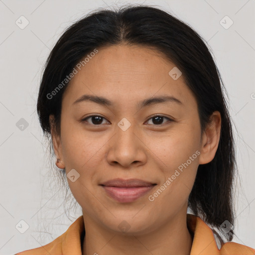 Joyful asian adult female with medium  brown hair and brown eyes