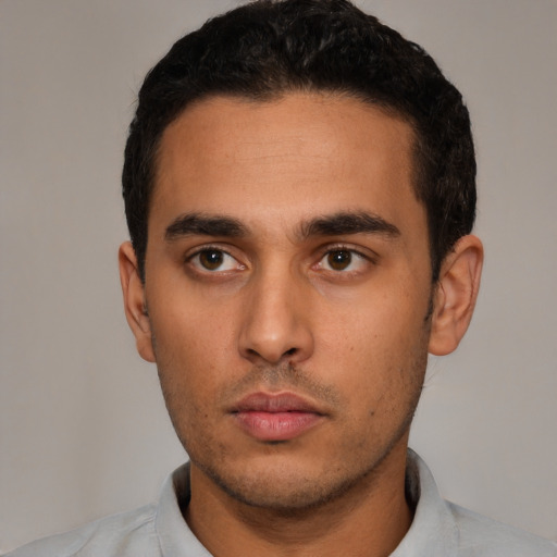 Neutral latino young-adult male with short  black hair and brown eyes