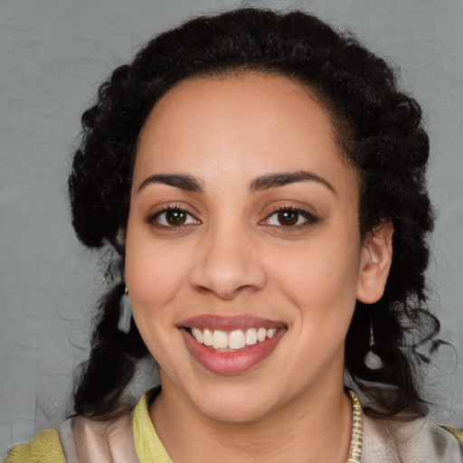 Joyful latino young-adult female with medium  black hair and brown eyes