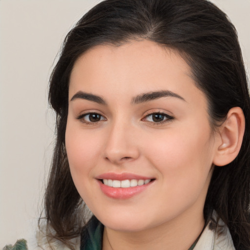 Joyful white young-adult female with medium  brown hair and brown eyes