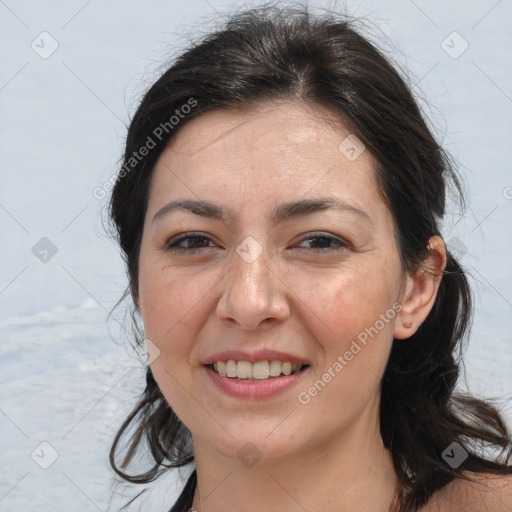 Joyful white adult female with medium  brown hair and brown eyes