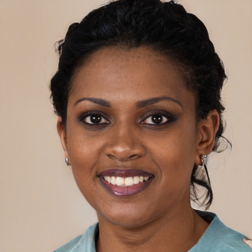 Joyful black young-adult female with medium  black hair and brown eyes