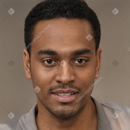 Joyful black young-adult male with short  black hair and brown eyes