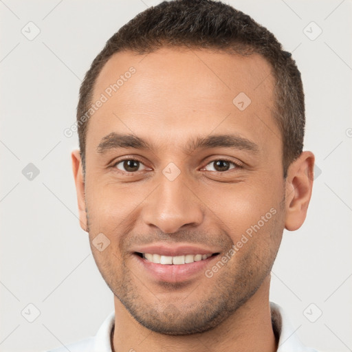 Joyful white young-adult male with short  brown hair and brown eyes