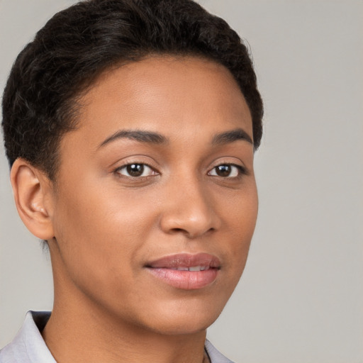 Joyful latino young-adult female with short  brown hair and brown eyes